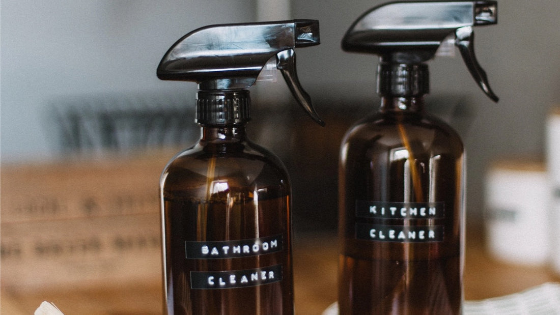 Amber glass cleaning bottles for refreshing your home.