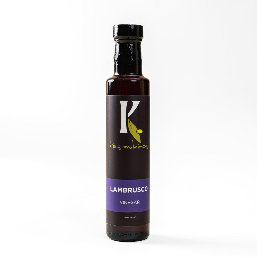 Bottle of Lambrusco vinegar with a black label on a white background
